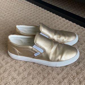 Lightly worn gold slip ons